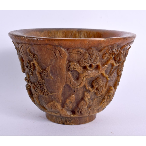 2087 - A CHINESE CARVED BUFFALO HORN TYPE LIBATION CUP 20th Century. 414 grams. 11 cm diameter.