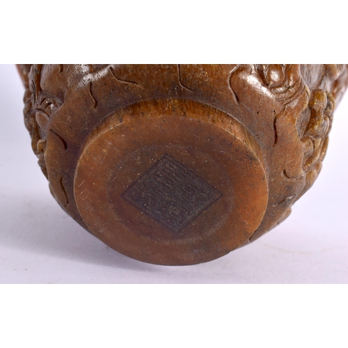 2087 - A CHINESE CARVED BUFFALO HORN TYPE LIBATION CUP 20th Century. 414 grams. 11 cm diameter.