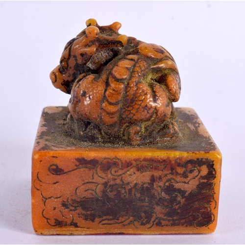 2090 - A CHINESE CARVED ORANGE SOAPSTONE SEAL 20th Century. 5.5 cm square.