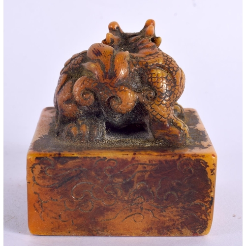 2090 - A CHINESE CARVED ORANGE SOAPSTONE SEAL 20th Century. 5.5 cm square.