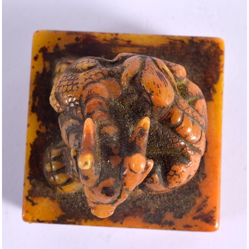 2090 - A CHINESE CARVED ORANGE SOAPSTONE SEAL 20th Century. 5.5 cm square.