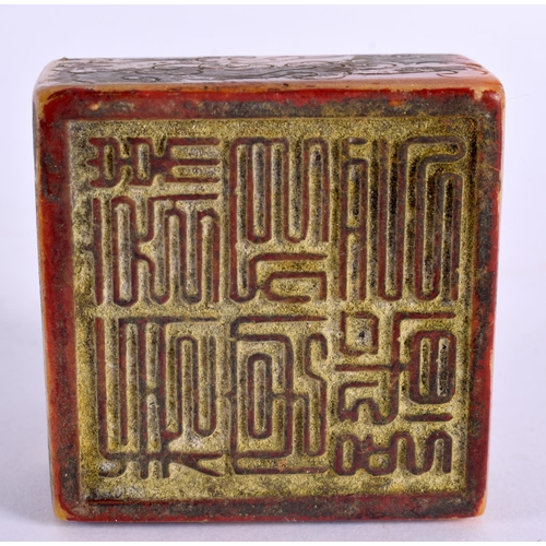 2090 - A CHINESE CARVED ORANGE SOAPSTONE SEAL 20th Century. 5.5 cm square.