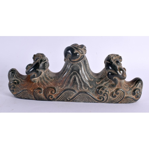 2093 - A CHINESE CARVED GREEN JADE TYPE BRUSH REST 20th Century. 19 cm wide.