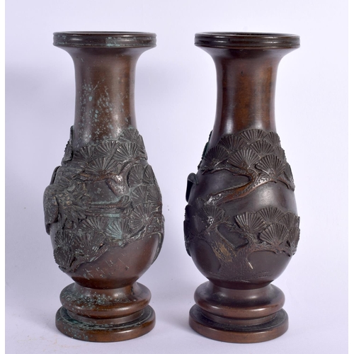 2103 - A PAIR OF 19TH CENTURY JAPANESE MEIJI PERIOD BRONZE VASES decorated in relief with birds and foliage... 