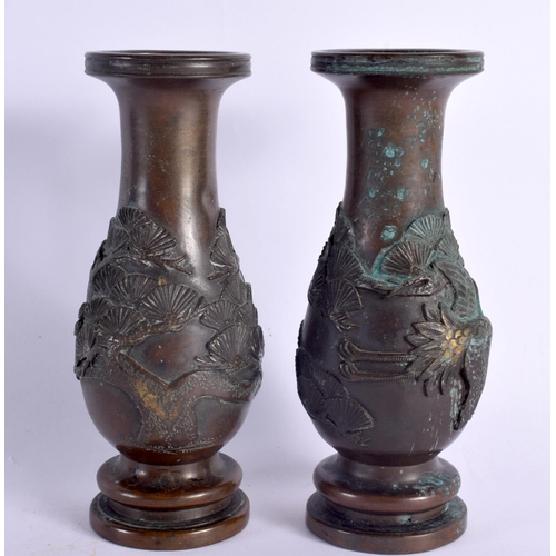 2103 - A PAIR OF 19TH CENTURY JAPANESE MEIJI PERIOD BRONZE VASES decorated in relief with birds and foliage... 