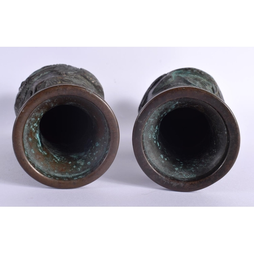 2103 - A PAIR OF 19TH CENTURY JAPANESE MEIJI PERIOD BRONZE VASES decorated in relief with birds and foliage... 