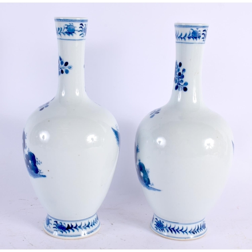 2104 - A PAIR OF CHINESE BLUE AND WHITE VASES 20th Century. 24 cm high.