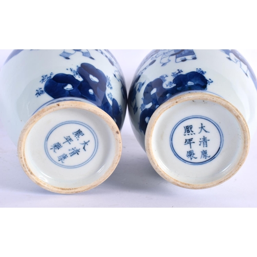 2104 - A PAIR OF CHINESE BLUE AND WHITE VASES 20th Century. 24 cm high.