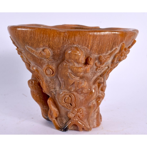 2124 - A CHINESE CARVED BUFFALO HORN TYPE LIBATION CUP 20th Century. 337 grams. 12 cm x 10 cm.