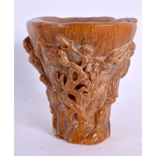 2124 - A CHINESE CARVED BUFFALO HORN TYPE LIBATION CUP 20th Century. 337 grams. 12 cm x 10 cm.