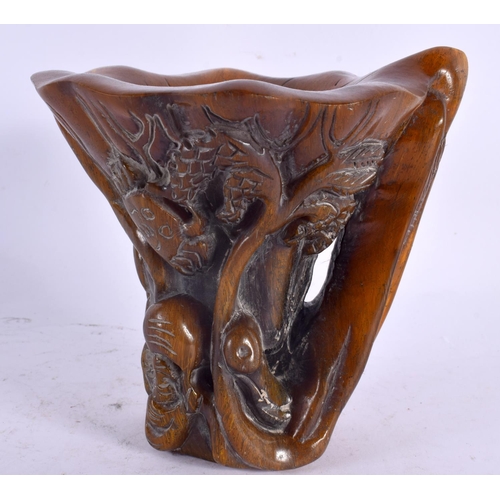 2125 - A CHINESE CARVED BUFFALO HORN TYPE LIBATION CUP 20th Century. 749 grams. 14 cm x 14 cm.