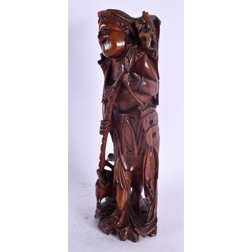 2127 - A 19TH CENTURY CHINESE CARVED HARDWOOD FIGURE OF A MALE Qing. 30 cm high.