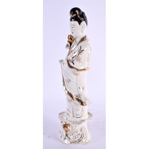 2134 - A LARGE CHINESE REPUBLICAN PERIOD PORCELAIN FIGURE OF AN IMMORTAL modelled holding a floral sceptre.... 