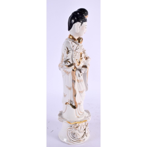 2134 - A LARGE CHINESE REPUBLICAN PERIOD PORCELAIN FIGURE OF AN IMMORTAL modelled holding a floral sceptre.... 