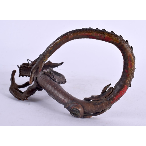 2135 - A 19TH CENTURY JAPANESE MEIJI PERIOD BRONZE OKIMONO modelled as a coiled dragon. 14 cm x 10 cm.