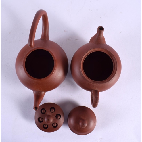 2142 - THREE CHINESE YIXING POTTERY TEAPOTS AND COVERS 20th Century. Largest 14 cm wide. (3)