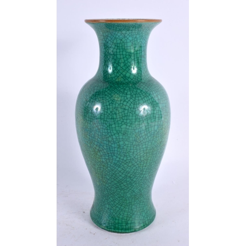 2176 - A CHINESE QING DYNASTY MONOCHROME CRACKLE GLAZED VASE of baluster form. 21 cm high.