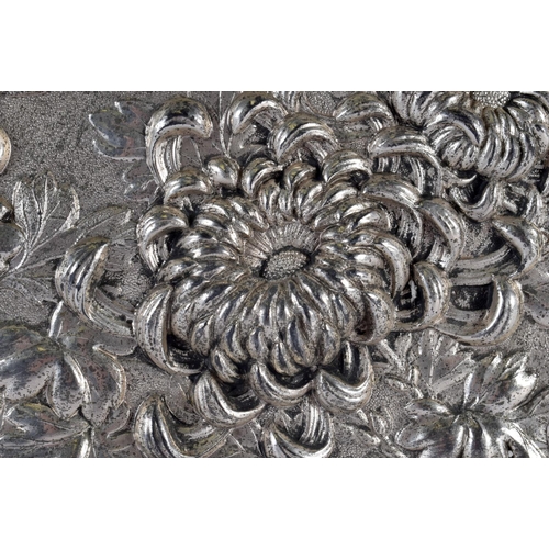 2180 - A LARGE 19TH CENTURY JAPANESE MEIJI PERIOD WHITE METAL REPOUSSE DISH decorated in relief with flower... 