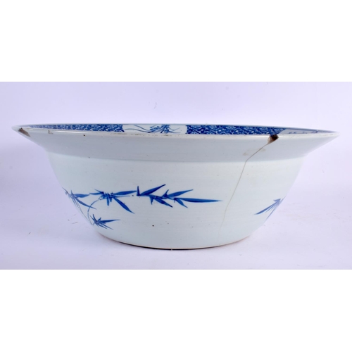 2185 - A LARGE MID 19TH CENTURY CHINESE BLUE AND WHITE PORCELAIN BOWL Qing, painted with two figures within... 