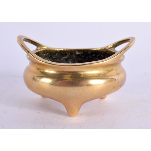 2200 - A MINIATURE 19TH CENTURY CHINESE TWIN HANDLED BRONZE CENSER of plain form. 140 grams. 7 cm wide, int... 