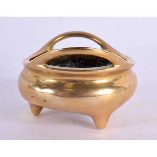 2200 - A MINIATURE 19TH CENTURY CHINESE TWIN HANDLED BRONZE CENSER of plain form. 140 grams. 7 cm wide, int... 