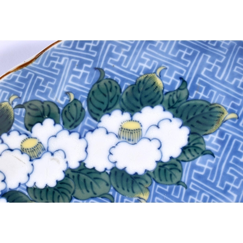 2207 - A JAPANESE TAISHO PERIOD BLUE AND WHITE PORCELAIN PLATE painted with flowers. 30 cm wide.