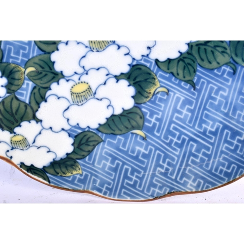 2207 - A JAPANESE TAISHO PERIOD BLUE AND WHITE PORCELAIN PLATE painted with flowers. 30 cm wide.