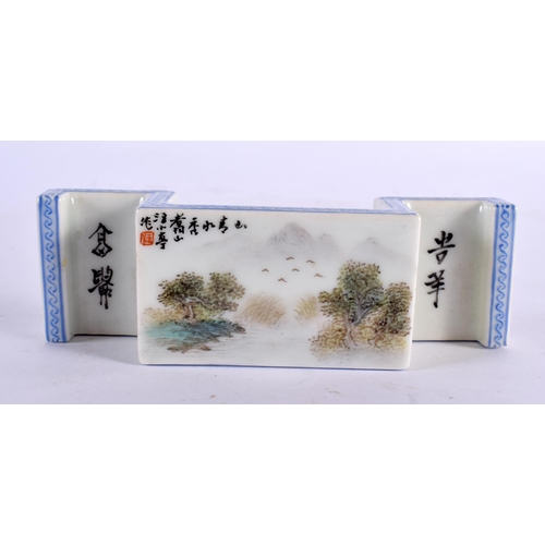 2210 - A CHINESE REPUBLICAN PERIOD PORCELAIN BRUSH REST painted with landscapes. 13 cm x 4 cm.