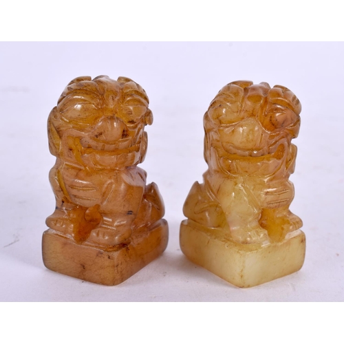 2212 - A PAIR OF 19TH CENTURY CHINESE CARVED SOAPSTONE BUDDHA together with a miniature pair of jade seals.... 