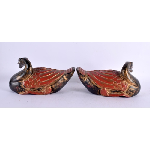 2218 - A PAIR OF CHINESE REPUBLICAN PERIOD POLYCHROMED WOOD DUCKS of naturalistic form. 21 cm wide.