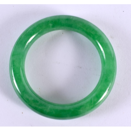 2230 - A CHINESE JADE BANGLE 20th Century. 104 grams. 8 cm diameter.