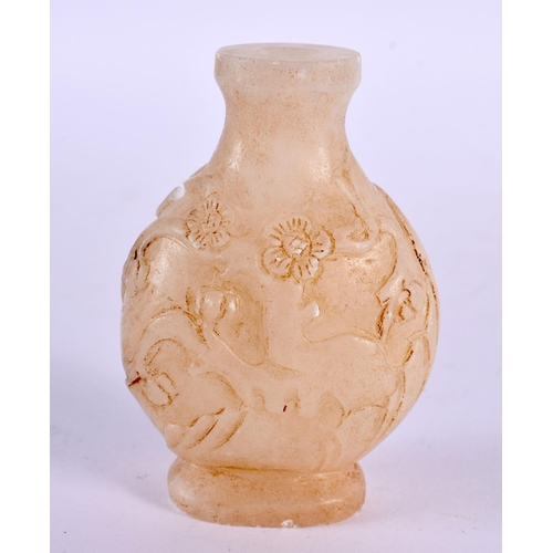 2239 - A CHINESE JADE VASE 20th Century, together with a jade toggle & archers ring. Largest 7 cm x 4.5 cm.... 