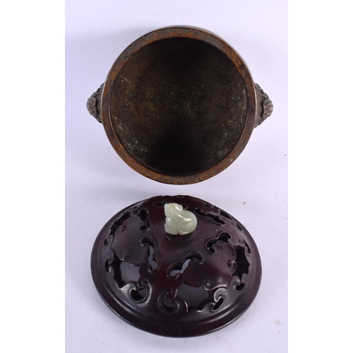 2241 - A CHINESE TWIN HANDLED BRONZE CENSER AND COVER 20th Century, bearing Xuande marks to base, with jade... 