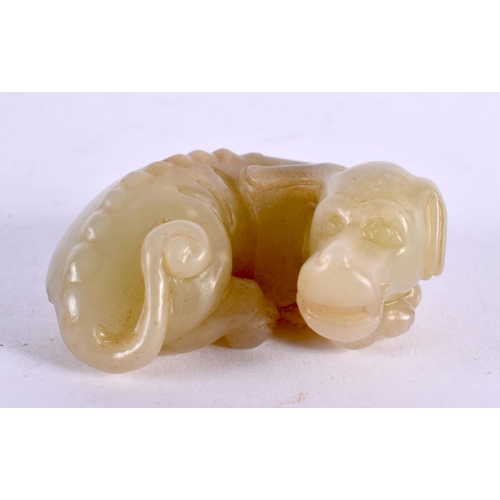 2251 - A CHINESE CARVED JADE DUCK 20th Century, together with a jade dog & flower group. Largest 9 cm wide.... 