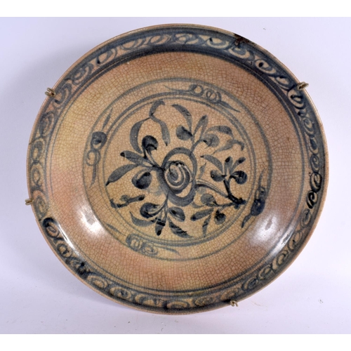 2259 - A 17TH/18TH CENTURY VIETNAMESE ANNAMESE POTTERY BOWL painted with sparse flowers. 28 cm wide.