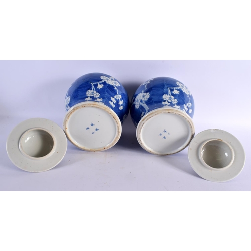 2281 - A LARGE PAIR OF 19TH CENTURY CHINESE BLUE AND WHITE PORCELAIN VASES AND COVERS Kangxi style. 32 cm x... 