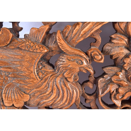 2296 - AN EARLY 20TH CENTURY CHINESE CARVED WOOD DRAGON AND PHOENIX PANEL Late Qing/Republic. 34 cm x 24 cm... 