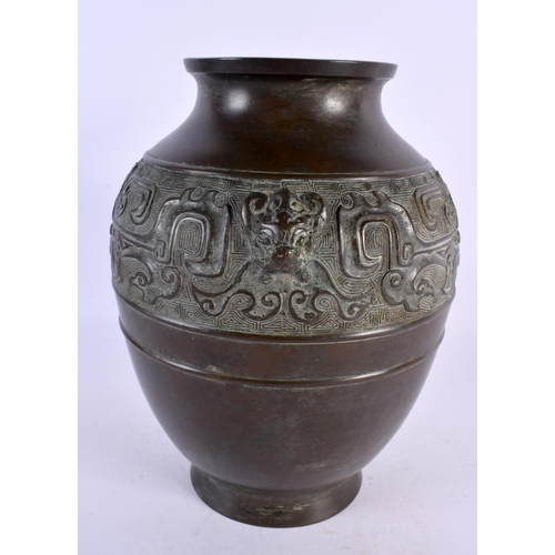 2302 - A 19TH CENTURY CHINESE TWIN HANDLED BRONZE VASE Qing, decorated in the archaic manner. 24 cm x 14 cm... 