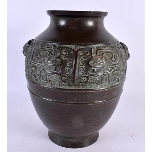 2302 - A 19TH CENTURY CHINESE TWIN HANDLED BRONZE VASE Qing, decorated in the archaic manner. 24 cm x 14 cm... 