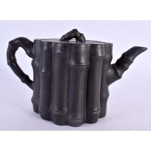 2311 - A CHINESE REPUBLICAN PERIOD YIXING POTTERY TEAPOT AND COVER of ribbed form. 15 cm x 9 cm.