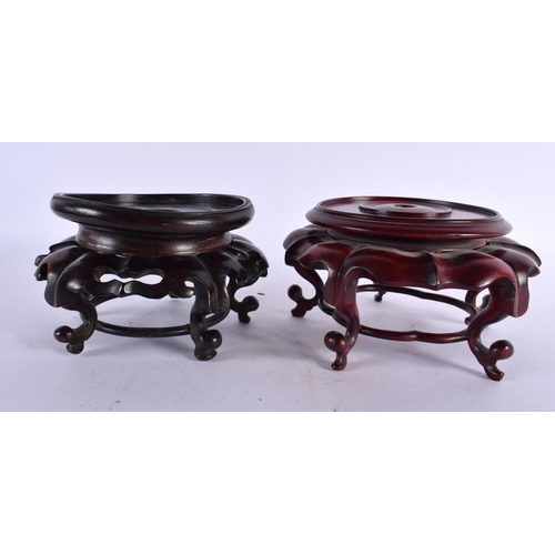 2314 - TWO CHINESE CARVED HARDWOOD STANDS 20th Century. Largest 12 cm x 9 cm. (2)