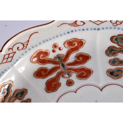 2317 - A RARE 18TH CENTURY JAPANESE MEIJI PERIOD IMARI SCALLOPED PLATE with raised motifs. 22 cm wide.