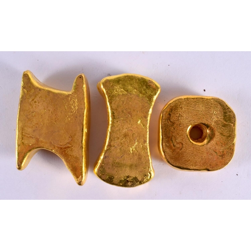 2330 - THREE CHINESE YELLOW METAL INGOTS 20th Century. 393 grams. Largest 6 cm x 3.75 cm. (3)