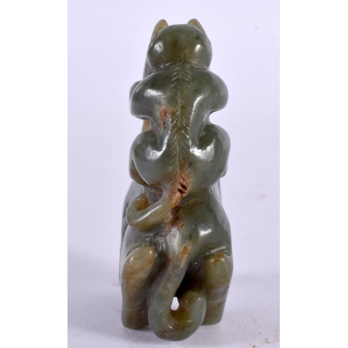 2345 - A CHINESE CARVED GREEN JADE BEAST 20th Century. 7 cm x 5.25 cm.