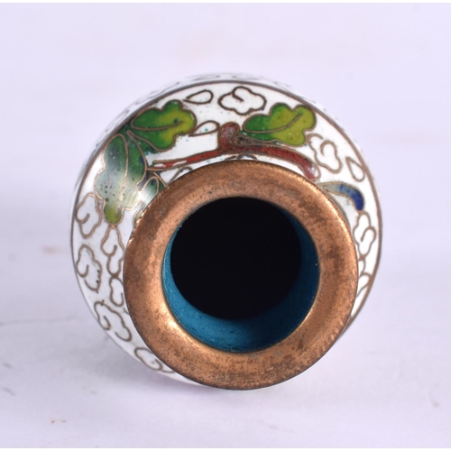 2350 - A CHINESE JADE ROUNDEL 20th Century, together with a miniature cloisonne vase. Largest 5.25 cm x 1 c... 