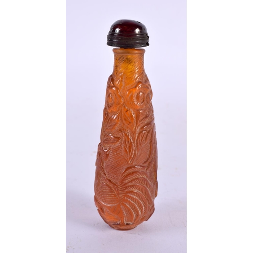 2352 - A CHINESE CARVED AMBER TYPE FLOWER SNUFF BOTTLE 20th Century. 9.5 cm x 3 cm.