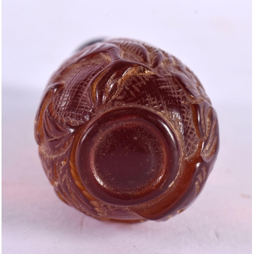 2352 - A CHINESE CARVED AMBER TYPE FLOWER SNUFF BOTTLE 20th Century. 9.5 cm x 3 cm.