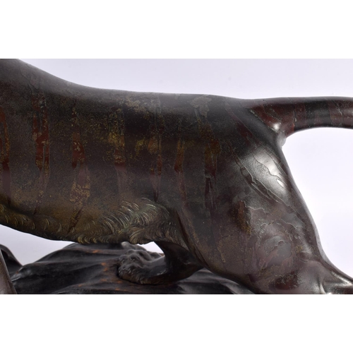 2371 - A LARGE 19TH CENTURY JAPANESE MEIJI PERIOD BRONZE OKIMONO modelled as a roaming tiger, with glass ey... 