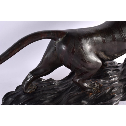 2371 - A LARGE 19TH CENTURY JAPANESE MEIJI PERIOD BRONZE OKIMONO modelled as a roaming tiger, with glass ey... 