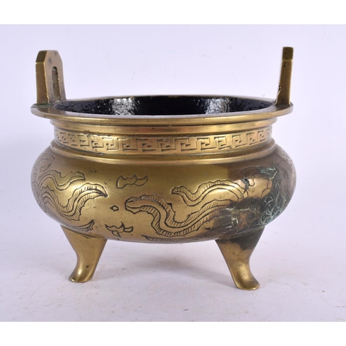 2384 - A 19TH CENTURY CHINESE TWIN HANDLED BRONZE CENSER bearing Xuande marks to base. 11 cm wide, internal... 